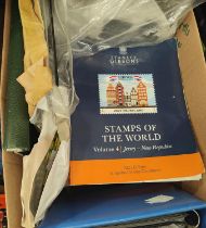 Box including Stanley Gibbons, World Catalogues 2023 plus album pages and accessories