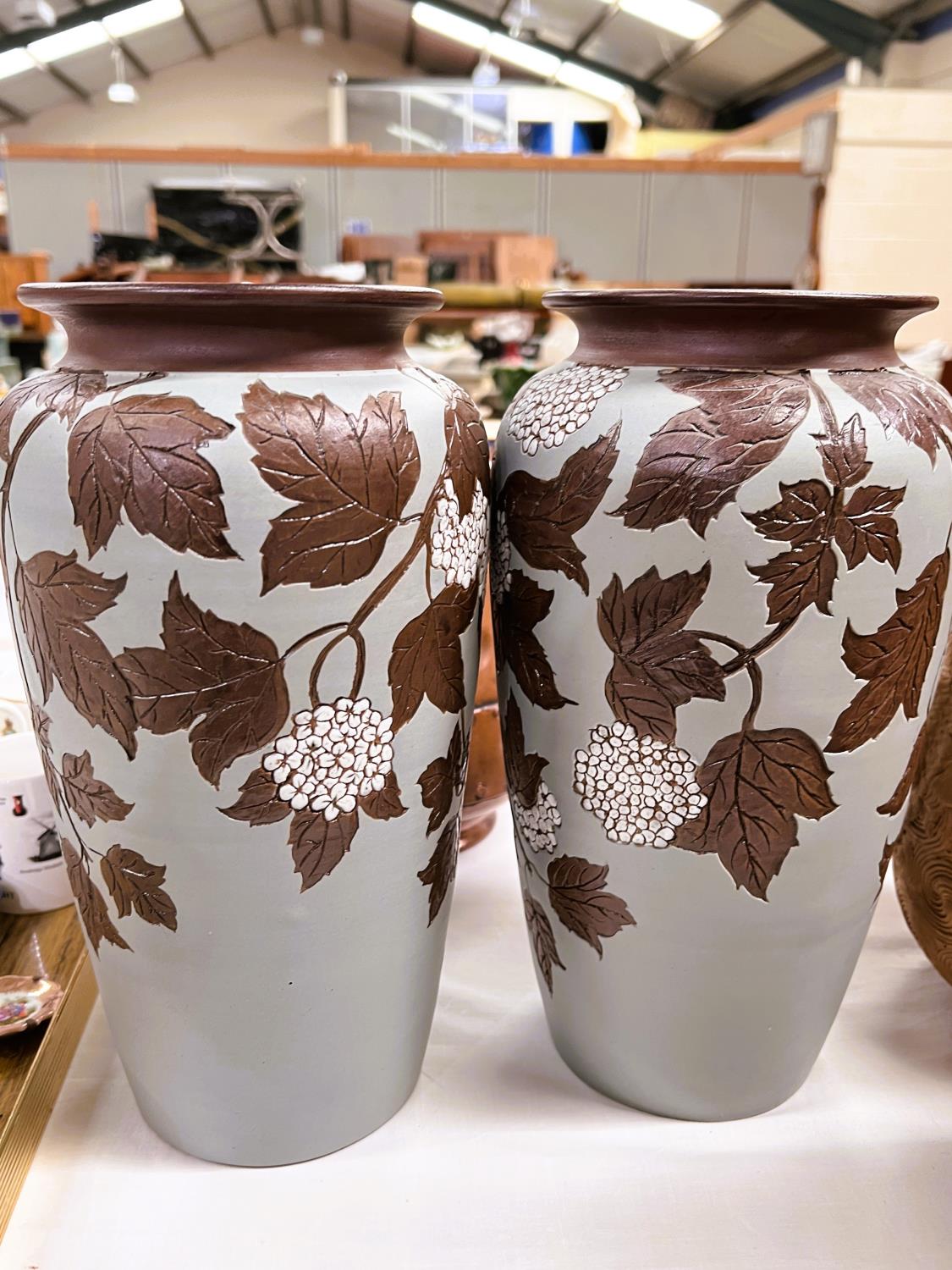 A pair of late 19th/early 20th century tapering stoneware vases with cut back and applied decoration - Image 2 of 7