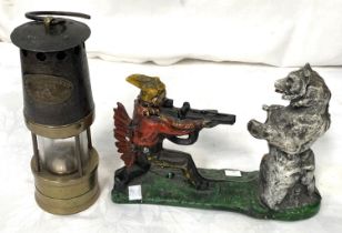 A miner's lamp by Ackroyd Best, a Victorian style cast iron novelty money box, man shooting bear