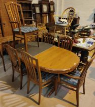 A Staf light teak extending dining table with extra interior leaf and a set of 6 (4+2) chairs