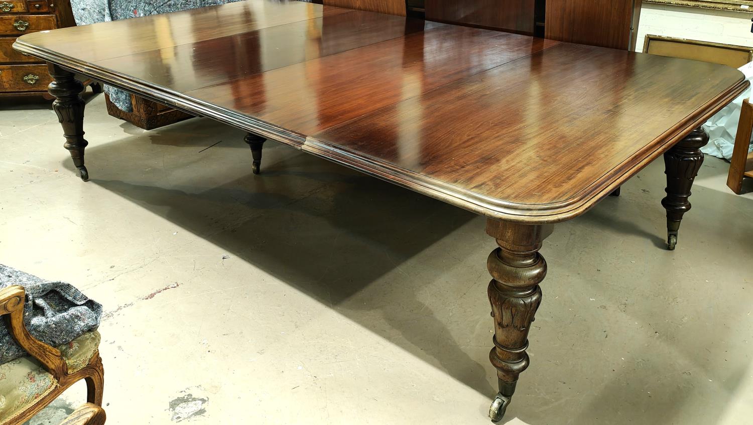 Banqueting Dining Table: A mid 19th century large and impressive rounded rectangular mahogany wind - Image 2 of 5
