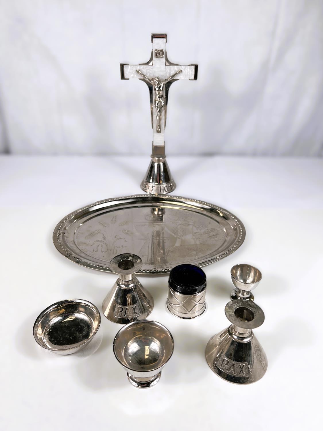 A silver plated altar set with crucifix, candlesticks etc