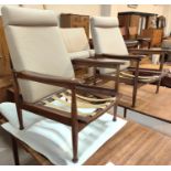 A mid century Guy Rogers teak pair of Manhattan adjustable/ reclining high back arm chairs and a