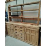 A large Victorian pine Welsh dresser with enclosed cupboard with 5 drawers and matched delft rack