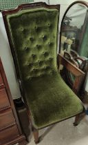 An Edwardian mahogany 'L' shaped nursing chair with green button back fabric and another mahogany