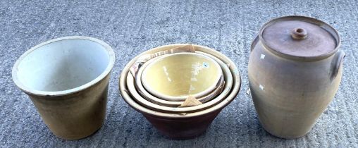 A graduating set of 4 bread crocks and similar items