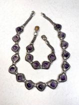 A white metal necklace and bracelet set with Blue John cabochon cut stones, stamped 925