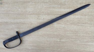 A British 1879 pattern Martini Henry saw back sword bayonet stamped with broad arrow WD, length 79cm