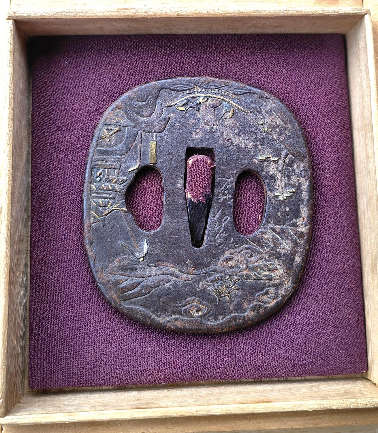 An 18th century Japanese mixed metal Tsuba in presentation box, signed