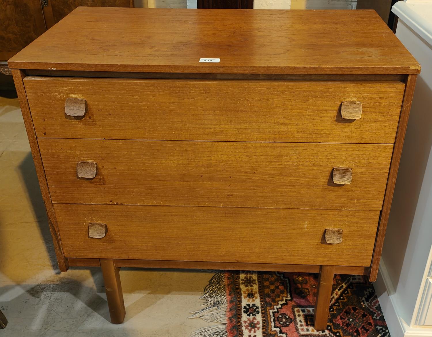 A 1970's G-Plan style teak 3 height chest of drawers and wall mirror