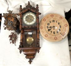 A Vienna wall clock with bamboo style carved decoration chiming movement; A painted metal Japy clock