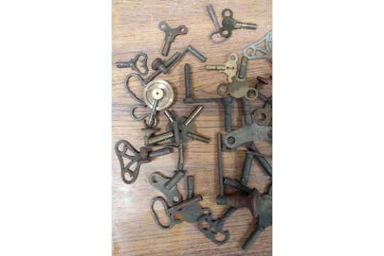 A collection of antique clock keys and some parts - Image 2 of 3