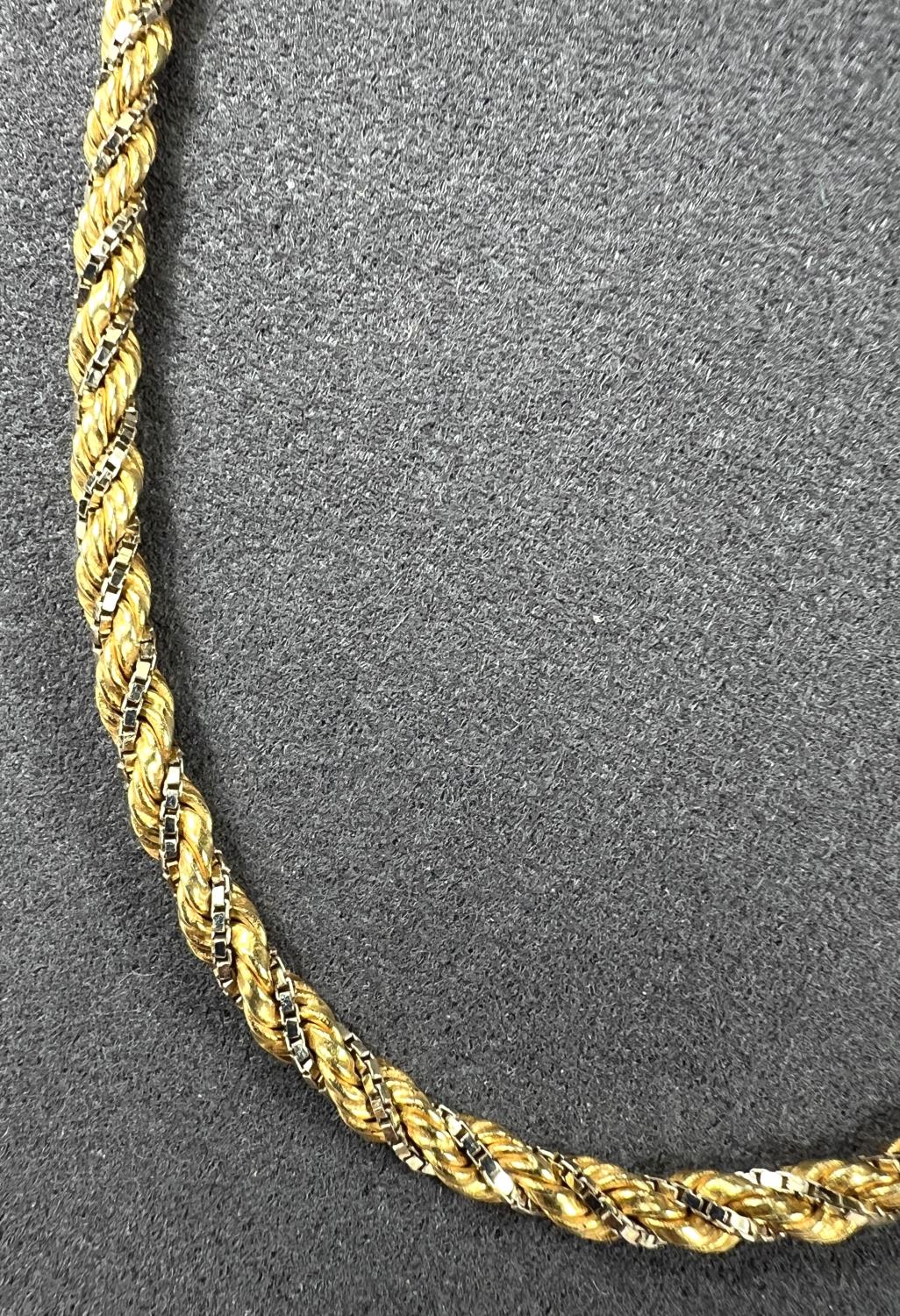 A yellow and white metal necklace stamped 18ct and 750, the design is yellow rope twist with white - Image 3 of 5