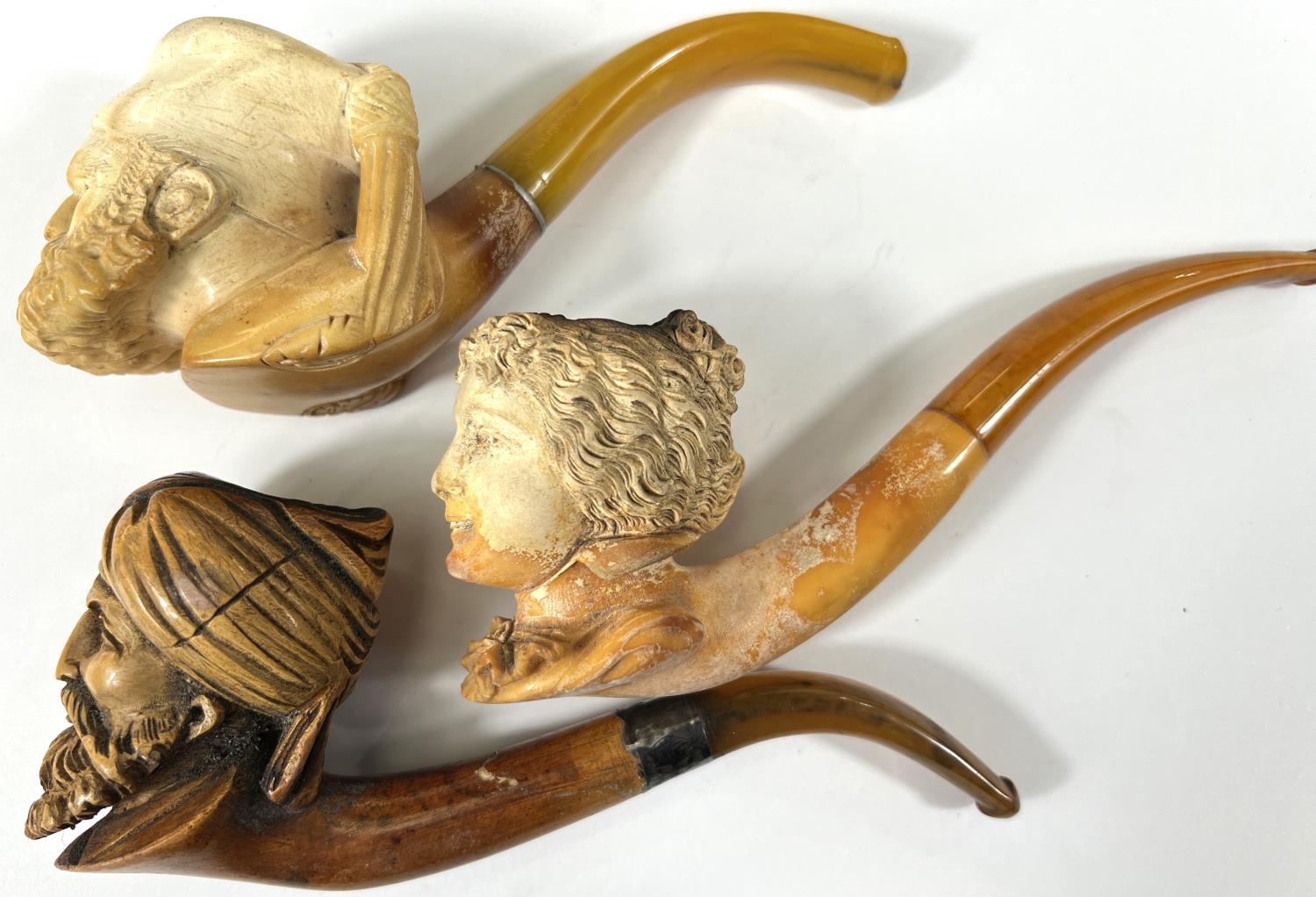 3 amber and Meerschaum pipes, 2 cased, depicting:- Turk's head with turban; bearded man's head and a - Image 3 of 7