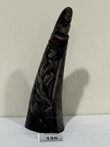 A bovine horn carved with reptiles and figural terminal. 8" high