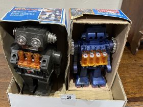 Two battery operated robot toys.