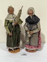 A pair of clay elderly woman dolls by J Jouglas. 12" high