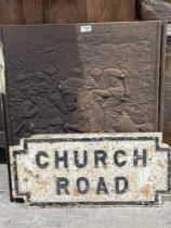 A cast iron street sign and a cast iron plaque or fire back. 30" high.