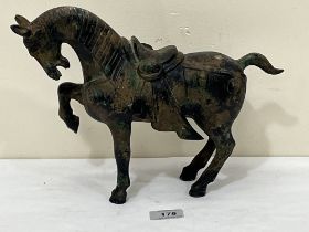 A Chinese bronzed white metal Tang style horse. 12" long.