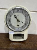 A 1930s metal enamel cased Smiths kitchen wall clock. 10" high