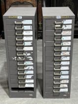 A pair of metal filing cabinets, one drawer lacking. 35" high