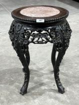 A 19th century carved rosewood pot stand with inlet marble top. 19" high.