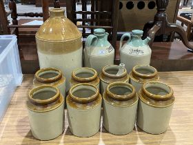 A collection of stoneware jars.