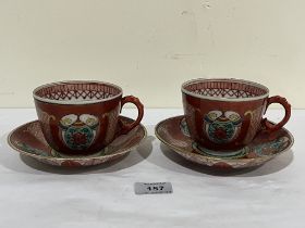 A pair of early 20th century oriental cups and saucers.