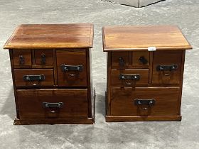 A pair of Indonesian hardwood bedside chests of drawers. 17" high.