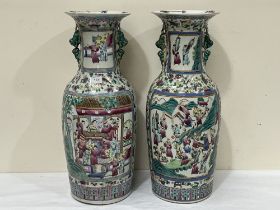 A pair of large Canton famille-rose vases, late Qing or Republic period, sturdily potted, painted