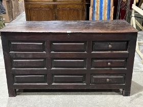 An 18th Century joined oak chest, later adapted with three drawers. 57" high.