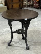 A cast iron based public house table. 27" diam.