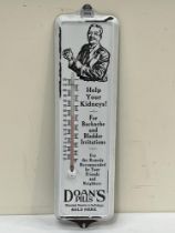 AN enamel sign for Doan"s Pills, with integral thermometer. 24" high