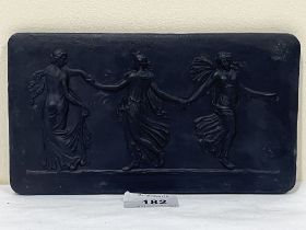 A 19th Century black jasparware plaque, moulded with the Three Graces. 8¼" wide.