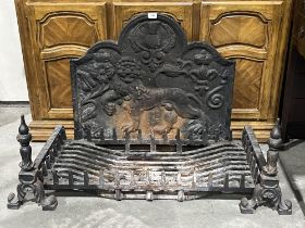 An inglenook cast iron fire grate, andirons and fire back. The grate 35" wide.