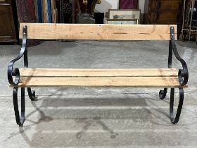 A garden bench with wrought iron ends. 60" wide.