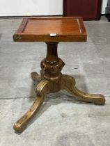 A Victorian walnut supper table base with tripod support.