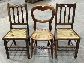 Three cane seated chairs.