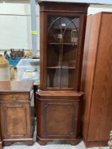A reproduction mahogany breakfast sideboard and a standing corner cupboard.