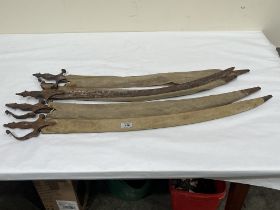 Four Indian Talwar sabres in cloth covered wood scabbards (A.F.) Length of blades 29".
