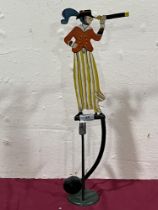 An American folk art style metal rocking figure toy. 21" high.