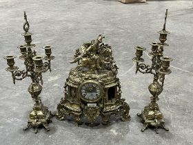 A brass clock garniture. (Losses)