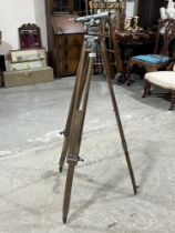 A Mall Bros. Survey theodolite on tripod stand.