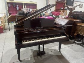 A Carlberg mahogany cased baby grand pianoforte.