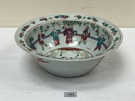 A 19th Century Chinese famille-rose bowl, painted with figures and foliage. 13¾" diam.