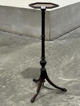 A Victorian mahogany jardiniere stand, the hexagonal top on cluster column and downswept tripod