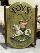 A reproduction toyshop sign. 34½" high.