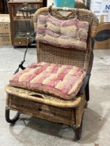 An early 20th century wicker picnic chair with folding back.