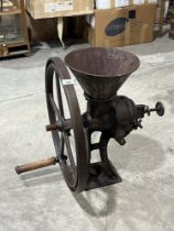 A cast iron industrial coffee grinder by Richmond and Chandler. 23" high.