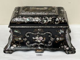 An early Victorian papier-mache and mother-of-pearl inlaid tea caddy in the manner of Jennens and